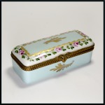 Stamp of Stamp Boxes Miscellaneous Materials: Handpainted porcelain stamp box with two sliding compartments, with gilt and coloured floral border on the lid