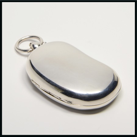 Stamp of Stamp Boxes 1909 Birmingham silver sovereign box, kidney shaped