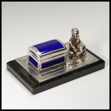 Stamp of Stamp Boxes Continental Boxes: White metal and enamel stamp box in the form of a trunk with a figure of a young beggar adjacent