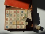 Stamp of Large Lots and Collections THE EARLIEST RECORDED PHILATELIC GAME: 1868ca. Memory game of 70 wooden pieces featuring reproductions of stamps