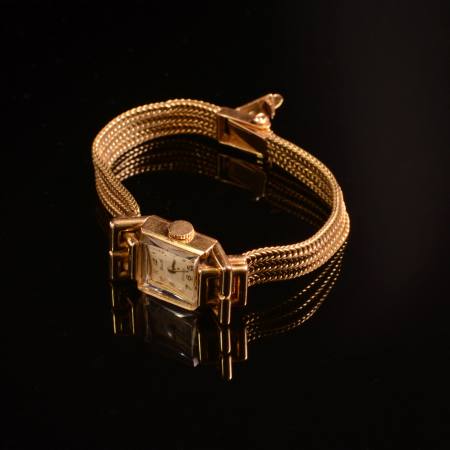 Stamp of Feldman International Auctions » Montres / Watches Dermont, montre-bracelet or jaune 750