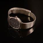 Stamp of Feldman International Auctions » Montres / Watches OMEGA DE VILLE. Montre à quartz en acier.