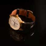 Stamp of Feldman International Auctions » Montres / Watches JAEGER LeCOULTRE MASTER GEOGRAPHIC. Montre mécanique en or jaune