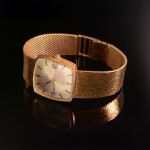 Stamp of Feldman International Auctions » Montres / Watches OMEGA. Montre mécanique en or jaune 750.