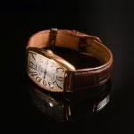 Stamp of Feldman International Auctions » Montres / Watches FRANCK MULLER CINTRÉE CURVEX. Montre automatique en or jaune 750