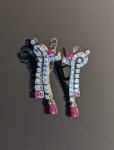 Stamp of Feldman International Auctions Paire de boucles d'oreilles rubis et diamants