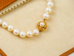 Stamp of Feldman International Auctions PATEK PHILIPPE ensemble perles