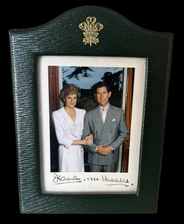 Stamp of Great Britain » Royalty 1990 Prince Charles and Princess Diana, a personally signed photograph dated 1990 and presented in its original green leather-bound frame with the Prince of Wales's feathers in gold at the top, the picture was presented 