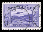 Stamp of New Guinea New Guinea 1935 Airplane £2 violet used, together with the famous Oneglia forgery on white paper in the form of a die proof.