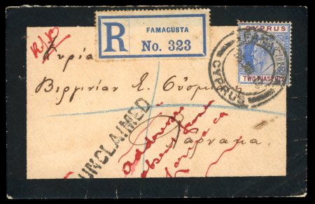 1913 Small registered mourning envelope from Famagusta to Larnaca, franked with KEVII 2pi on the front and KGV ½pi on the reverse, both tied by double-circle FAMAGUSTA/CYPRUS datestamps. Showing the scarce linear "UNCLAI